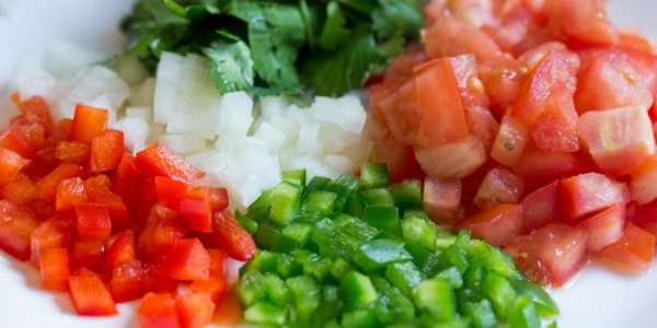 pexels-photo-128391-128391 Colorful diced vegetables on a plate, perfect for healthy cooking and meal prep.